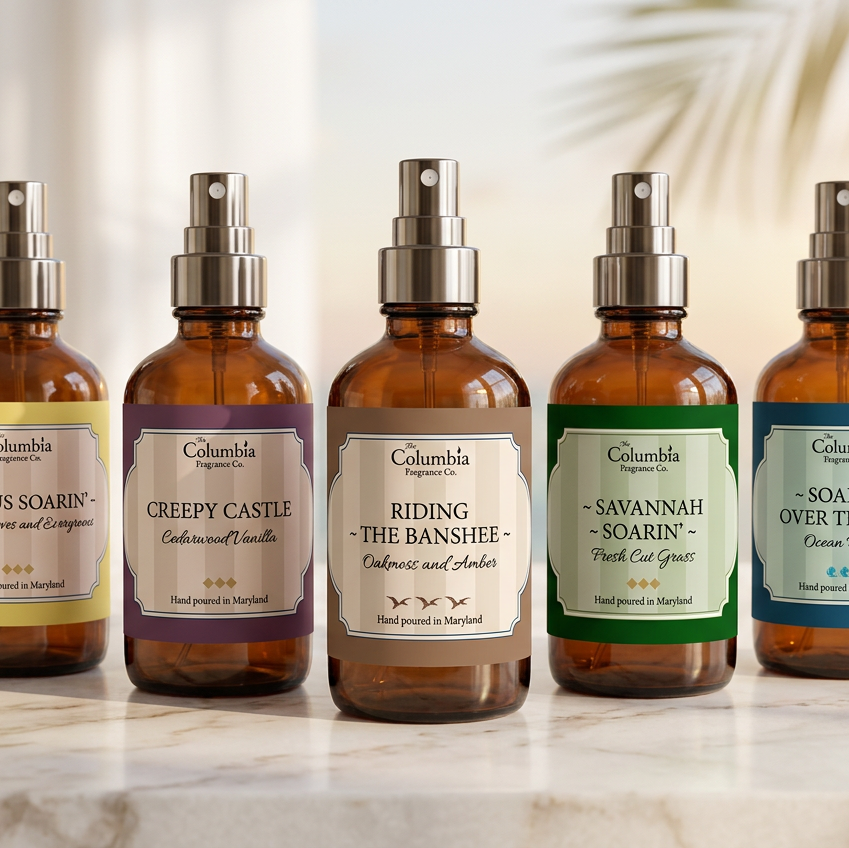 Five bottles of Columbia Fragrance sprays on a light background